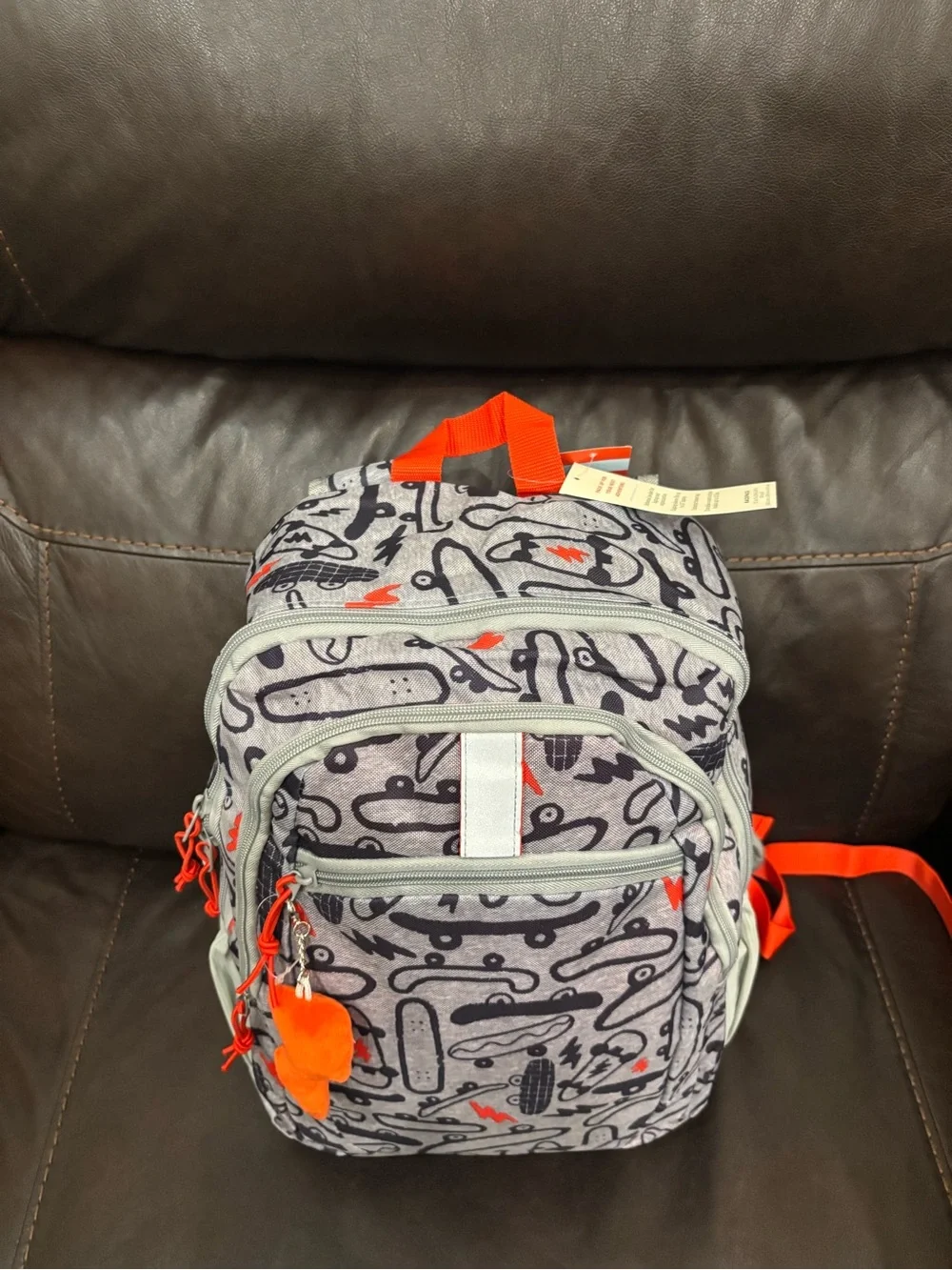 New with tags Kids Skateboard Print Backpack in Gray with Orange Accents